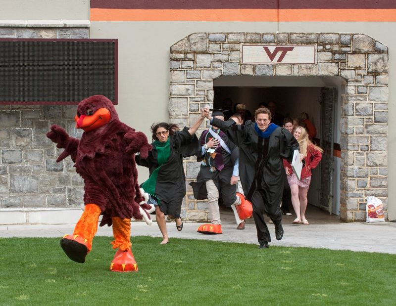 The HokieBird led commencement speakers Virginia Tech Professor Marc Edwards and Mona Hanna-Attisha, director of the Michigan State University and Hurley Children’s Hospital Pediatric Public Health Initiative, and the Flint Water Study team onto the field.