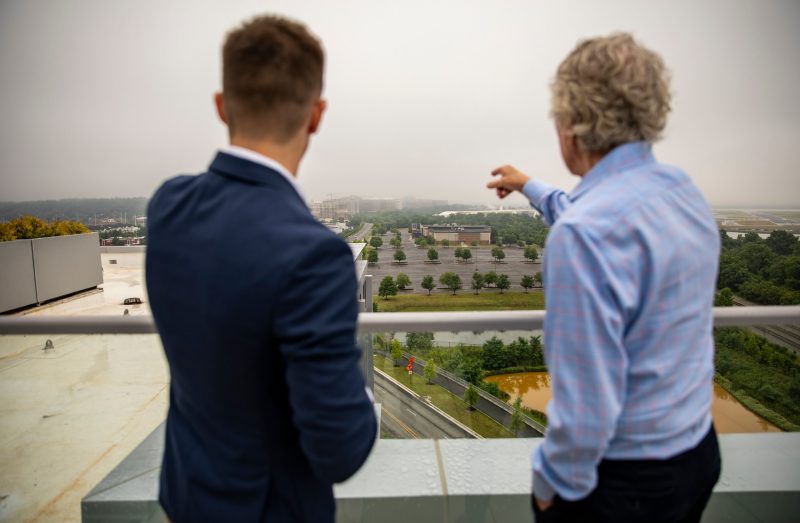 Attendees look out over the future Innovation Campus space.