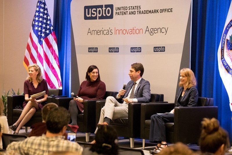 A four person panel discussion at the US Patent and Trademark Office event, with Brandy Salmon sitting in the rightmost of four chairs.