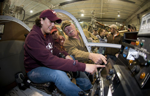 Art Sanford shows Courtney Hall (left) how to conduct precision application of pesticides