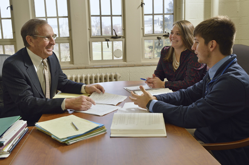 Richard Crowder, at left, talks with students.