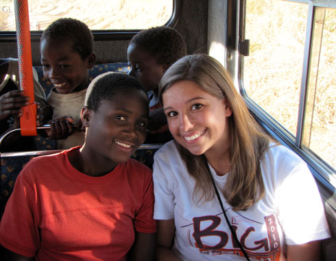 Children share the excitement of being on a bus with Virginia Tech sophomore Becca FitzGerald.