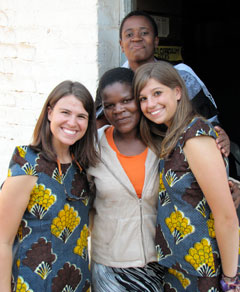 The teachers at Domasi Government School showed their appreciation by giving Malawian outfits to students Lauren Scheid and Rebecca FitzGerald.