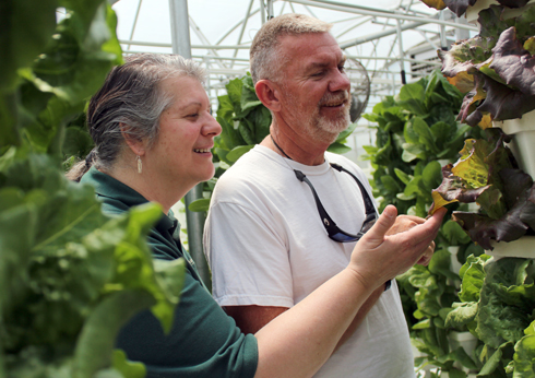 Amber Vallotton, at left, talks with a farmer.