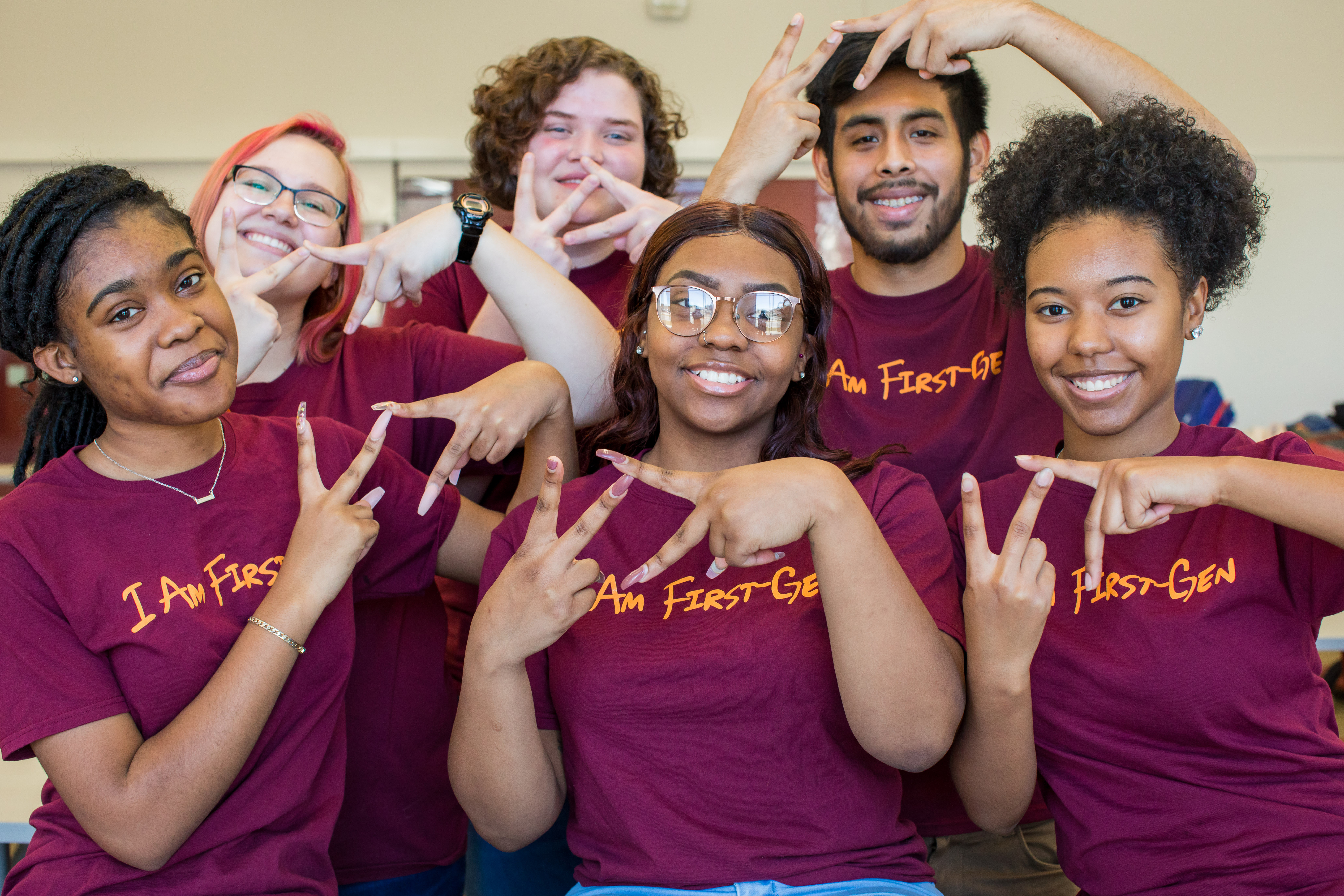 Burruss Hall in summer A group of first-generation students wearing matching t-shirts at a first generation students event in 2019.