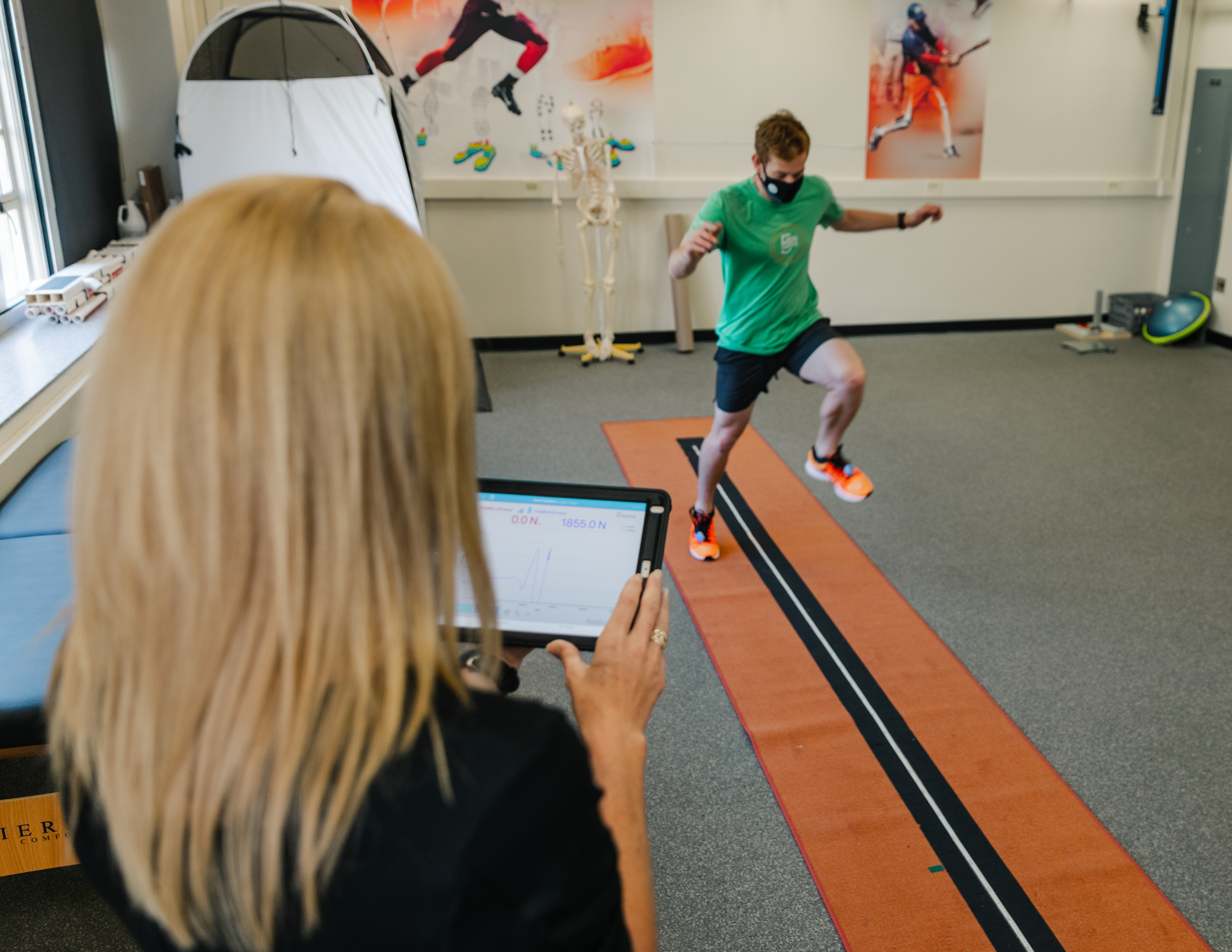 A person jumps from side to side in a lab setting