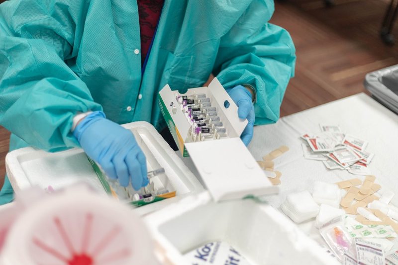 Medical tech prepping a vaccination station
