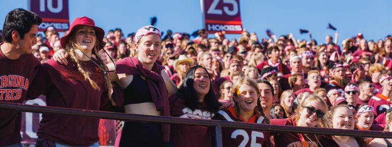 Students cheering at the 2023 Homecoming football game